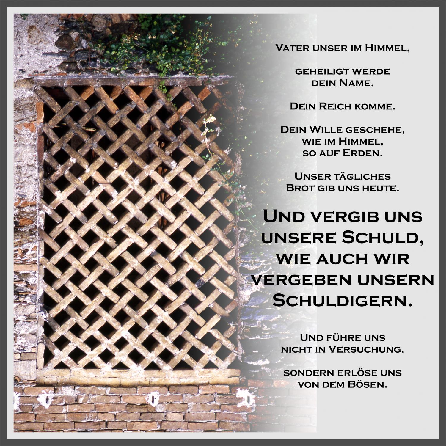 text vom vater unser gebet und vergittertes Holzfenster